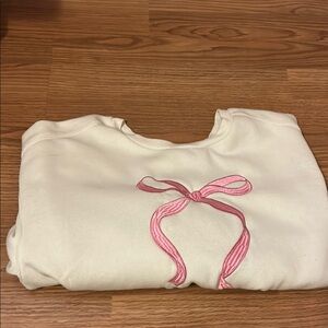 Cream Sweatshirt with Pink Bow Design